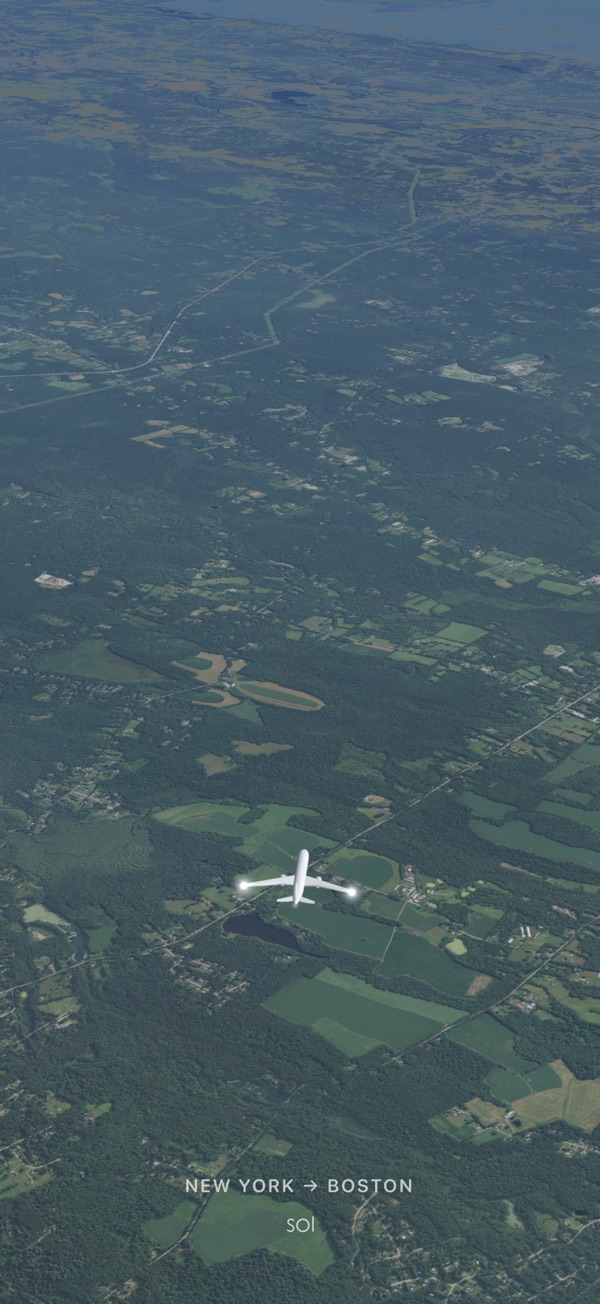 A flight in Sol from New York to Boston, seen from behind the aircraft over the Earth, lit as it is now.